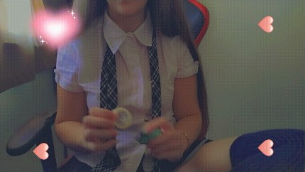 Horny student opening condom and making a handjob
