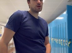 Horny Lorenzo strokes his big, hard cock in the locker room, looking at you gif