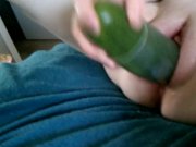 Preview 1 of Cucumber spreading pink pussy.