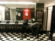Thief changes into fully lubed rubber gear in public washroom