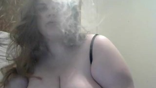 While Playing With Her Big Tits And Hard Nipples The Wife Of A Huge DDD Tit Smokes