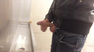 Urinating And Jerking In A Public Restroom Urinal