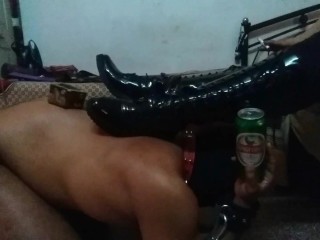 Mistress Makali uses a Slave as a Foot Stool and a Bottle Holder
