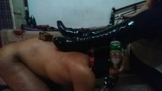 Mistress Makali uses a slave as a foot stool and a bottle holder