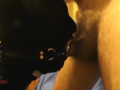 Masked, cuffed, ring gagged slut in black PVC deepthroated