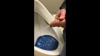 Soiled Boy Urinating In A Soiled Urinal