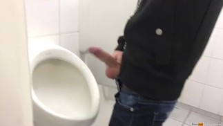Gay boy is jerking off in public restroom and shoot his load in a urinoir