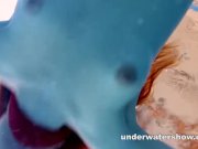 Preview 5 of Redhead Mia stripping underwater