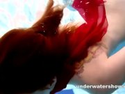 Preview 6 of Redhead Mia stripping underwater
