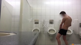 Exhibitionist boy is pissing in a urinoir - long gif video
