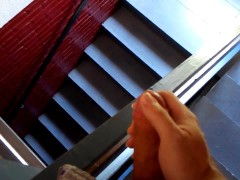 Wanking in a public staircase