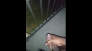 Playing with my cock on the balcony