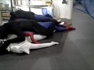 Black Meshed Frogman vs White Spandex and Spiderman Dummy