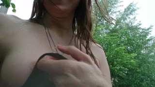 Public boobs flash outdoors in the rain