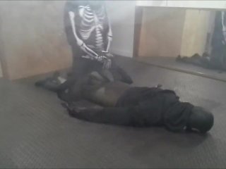 skeleton wearing a wetsuit