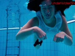 Sexy cute beauty Alla swims in the swimming pool