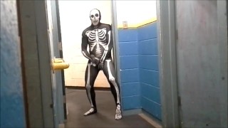 skeleton with hard on jerks off in gym hall