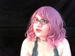 Coco smoking with pink hair and glasses