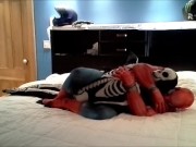 Preview 1 of spiderman having fun with his toy skeleton