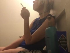 sexy skinny blonde smokes in front of boyfriend