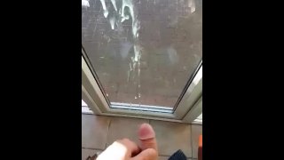 Shooting a huge load against the window
