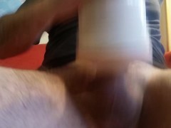 Guy moaning and shaking while cumming inside a fake pussy