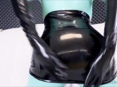 wearing latex catsuit with black and jade color combo