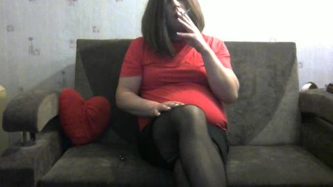 Curvy Tranny smoking cigarette in sexy skirt