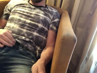 Pulling out bulging cock from jeans and stroking