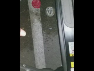 Cumming in public in a parking lot outside