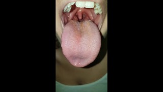 Girl Burping With A Wide Open Mouth
