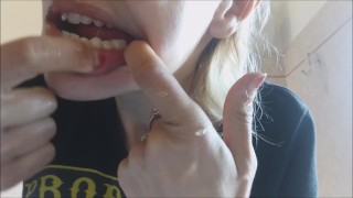 Attractive Girl Flosses Her Teeth