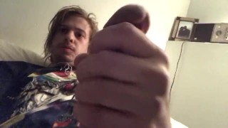 Hot Grungy dude lays in bed and strokes his big thick Cock and watches porn