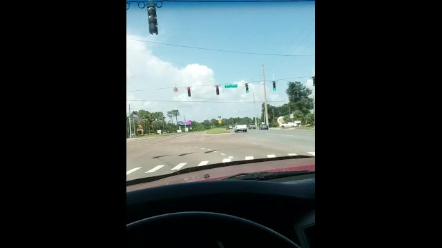 Playing with my wet juicy pussy at a red light