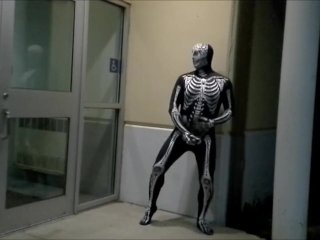 nighttime skeleton jerking off in front of outside doors
