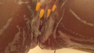 Sexy ebony playing with herself in the shower