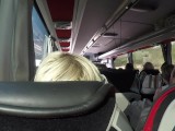 The naked blonde masturbates in a public bus.