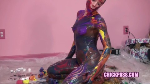 Kinky coed Lina is covering her naked young body with paint