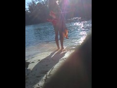 blonde sheds her top in public on river beach as butterfy shed cocoons