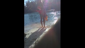blonde sheds her top in public on river beach as butterfy shed cocoons