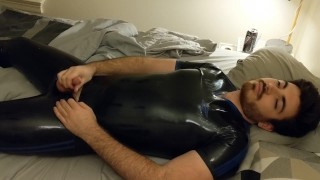 rubber boy unlocking and eating cum