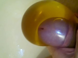 Pissing into a condom