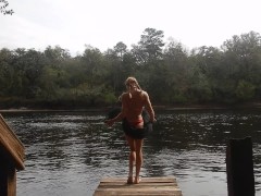 toned blonde in bikini public striptease near river in florida goes topless
