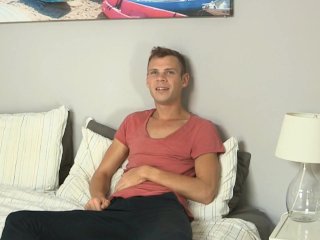 One hand jerks Camerons cock, the other probes his ass