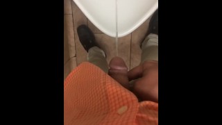 Boy pissing at work