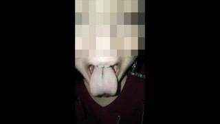 Girl With A Big Mouth And A Long Tongue Spits
