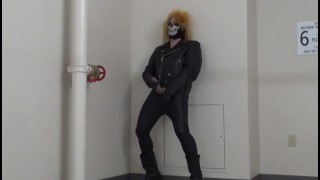 masked leather man quickly shoots his load in hotel stairway