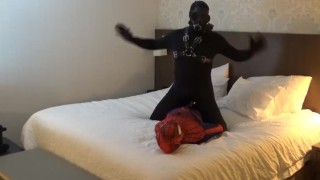 mindless moaning black sex drone playing with his spiderman dummy