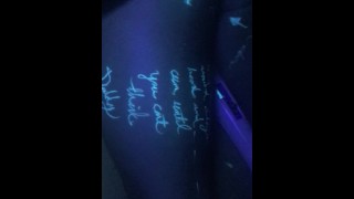 A Spoiled Blacklight Body Writer Writes Hitachi And Cock On A Tied-Up Princess