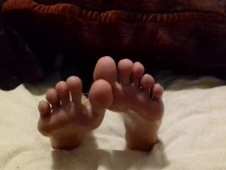 Rubbing cum into my feet and spreading my toes